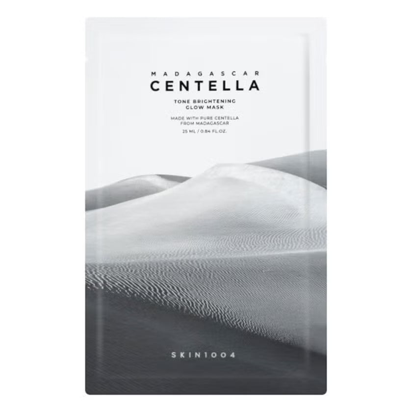 A single skincare pouch for SKIN1004 Madagascar Centella Tone Brightening Glow Mask, featuring a minimalist black and white dune design on a white background.