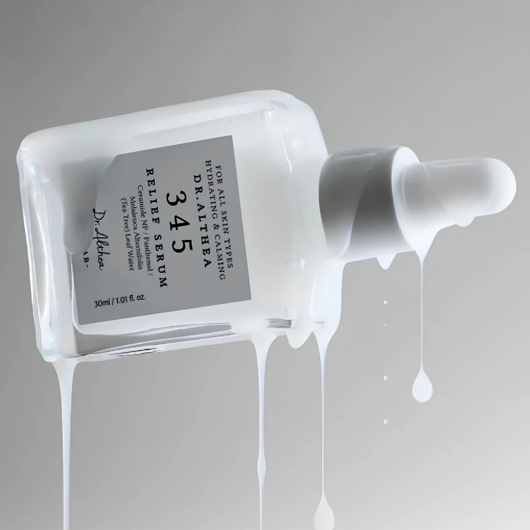 Dr. Aithea relief serum bottle with dropper on a gray background