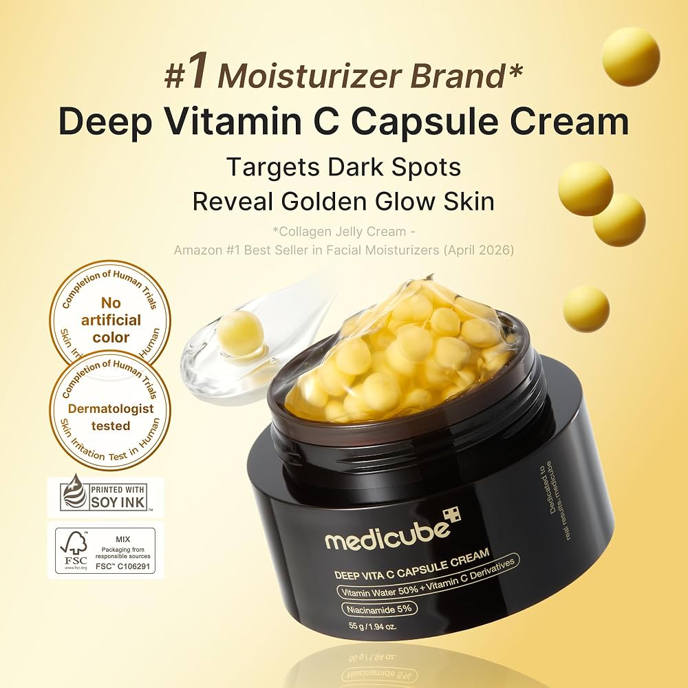 Medicube Deep Vita C Capsule Cream in a black jar with a clear lid showing yellow gelatin capsules, set against a light beige background with floating yellow capsules and product callouts.