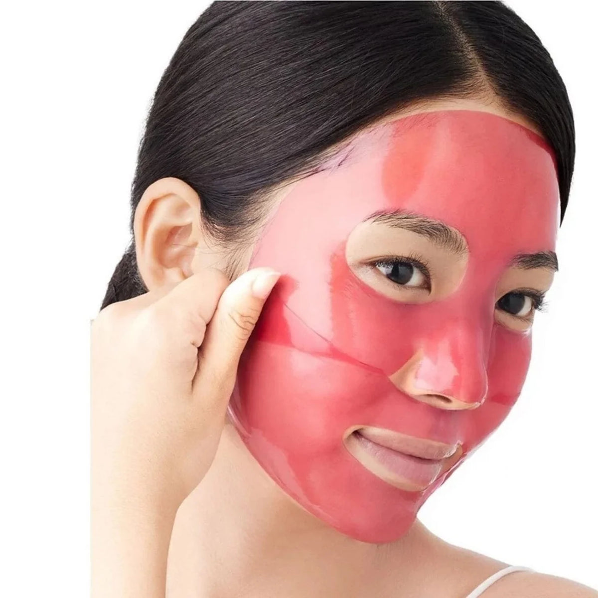 A close-up of a woman with a Arencia Red Collagen Jello Mask being peeled off her face with her hand, set against a plain white background.