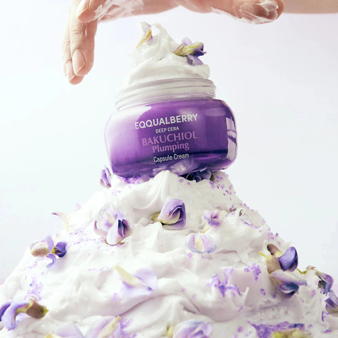 EQQUALBERRY Bakuchiol Plumping Capsule Cream bottle with white foam and purple flowers on a white background