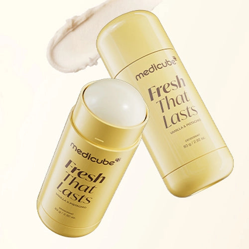 Two Medicube Fresh That Lasts deodorant sticks with a white cream stick on top, set against a clean off-white background with a matching cream smear in the upper left.