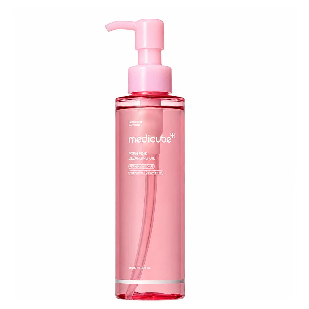 A pink pump bottle of Medicube PDRN Mild Cleansing Oil on a solid white background.