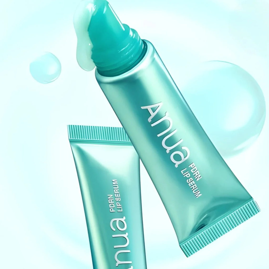Two anua pdrn lip serum bottles with 'ANUA' branding on a light blue background