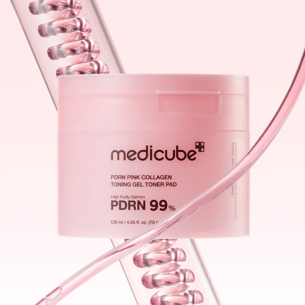Pink skincare product packaging with 'medicube' branding on a light pink background