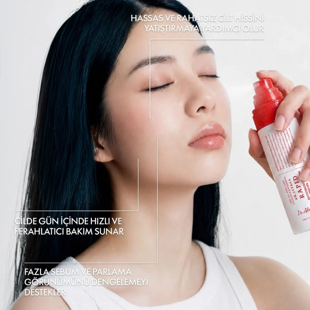 A woman with closed eyes holds a Dr. Althea Rapid Hypochlorous Acid Rescue Mist
