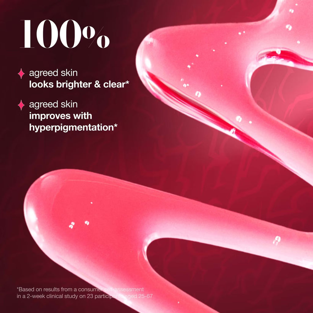 Close-up of Anua x KPop Demon Hunters, Niacinamide 10 TXA 4 Serum pink serum texture with text on a dark background