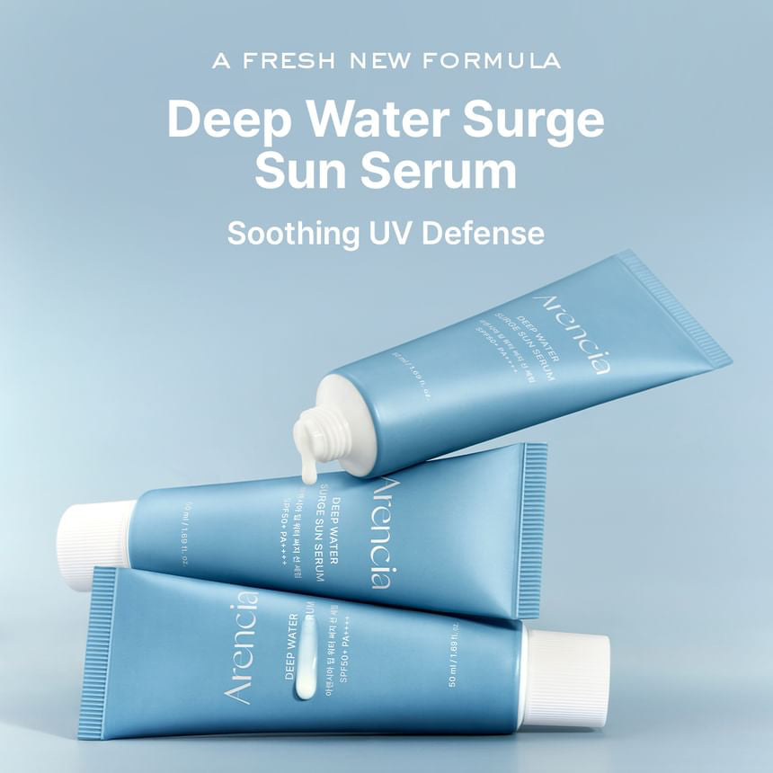 Three tubes of Arencia Deep Water Surge Sun Serum on a light blue background