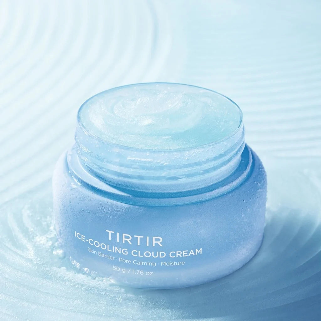 A light blue jar of TIRTIR Ice-Cooling Cloud Cream with a matching lid, set against a textured light blue background with subtle ripples.
