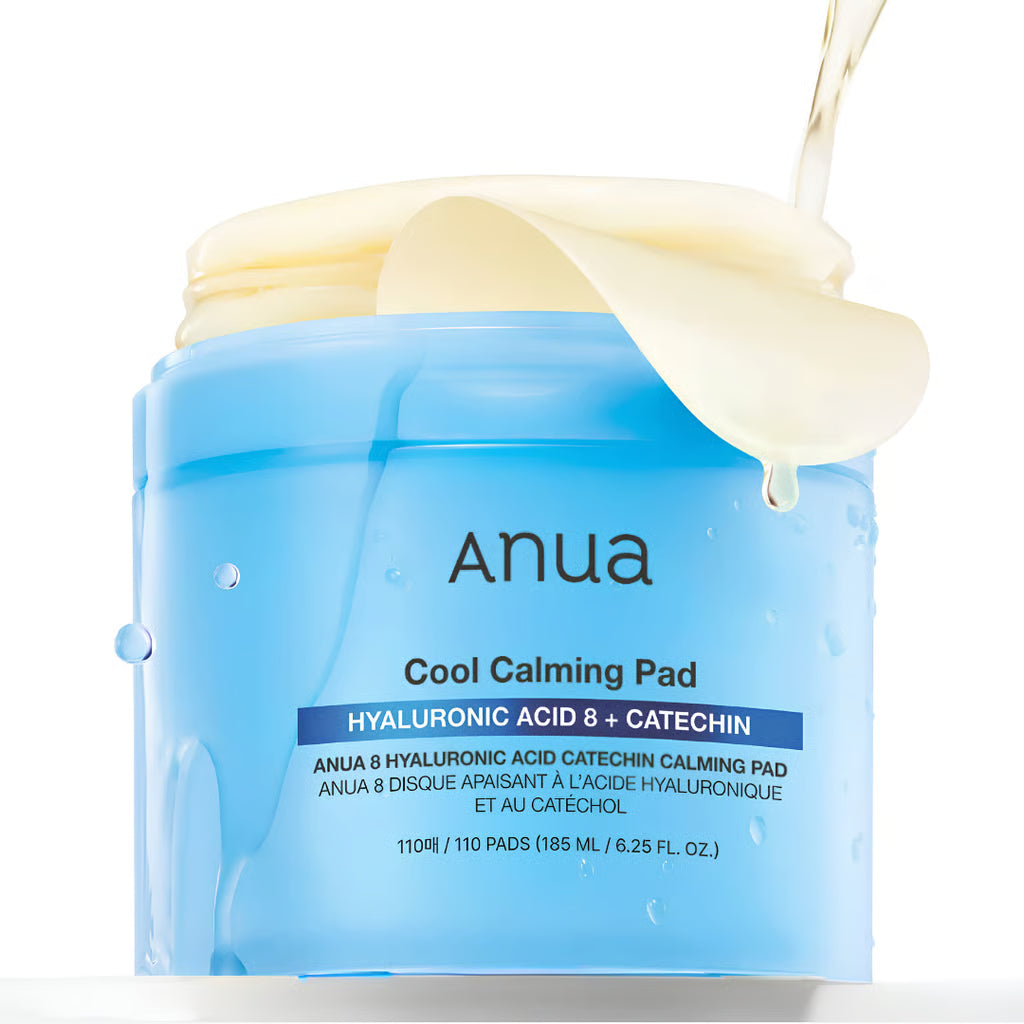 Anua Hyaluronic Acid 8 + Catechin Cool Calming Pad  in light blue with a cream-colored product being dispensed from the lid, shown on a white background.